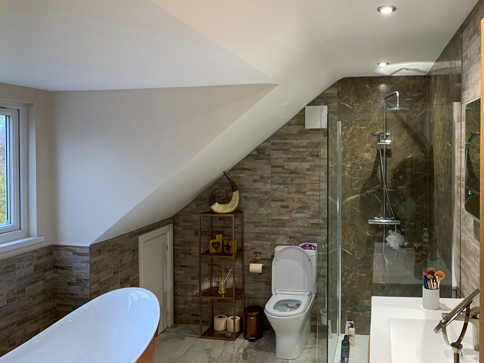 bathroom and sloping ceiling in bathroom of double extension